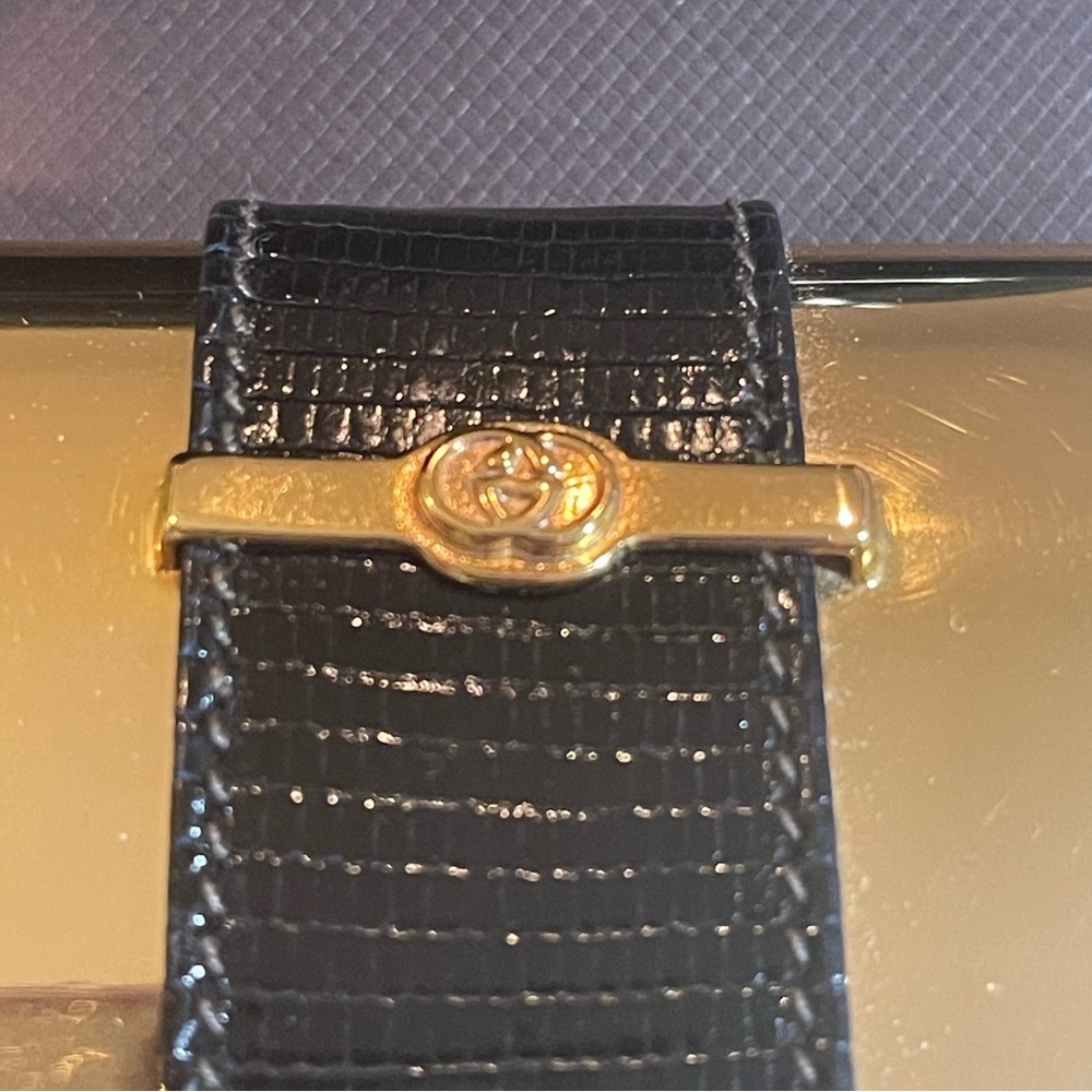 Gold Gucci clutch